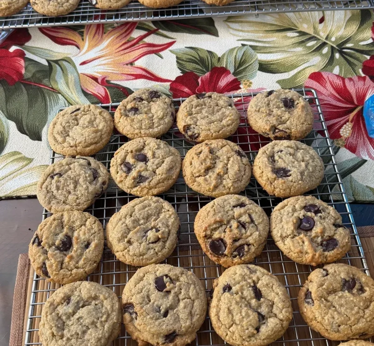 Freshly baked cookies on floral tablecloth